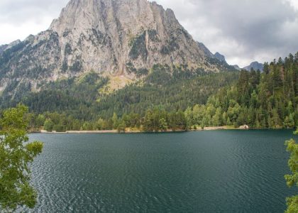 Beautiful landscape of Estany de Sant Maurici with Gran Encantat in the background, Catalonia, Spain.